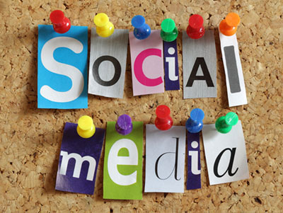 Social Media from cut out letters pinned to board