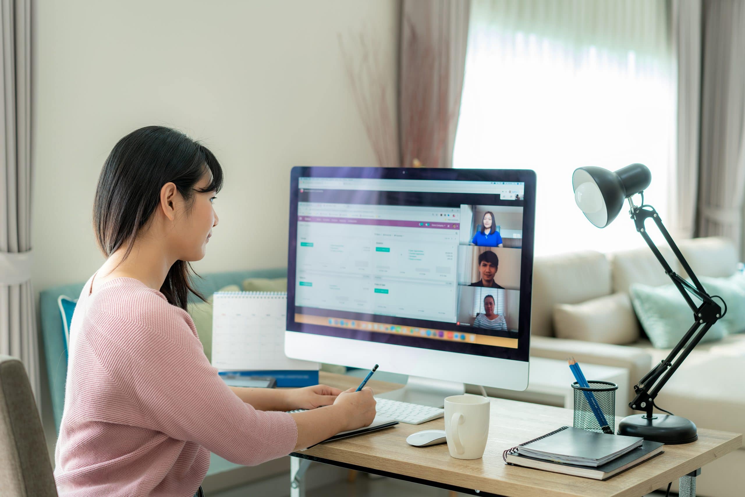 Woman sitting at computer on video call