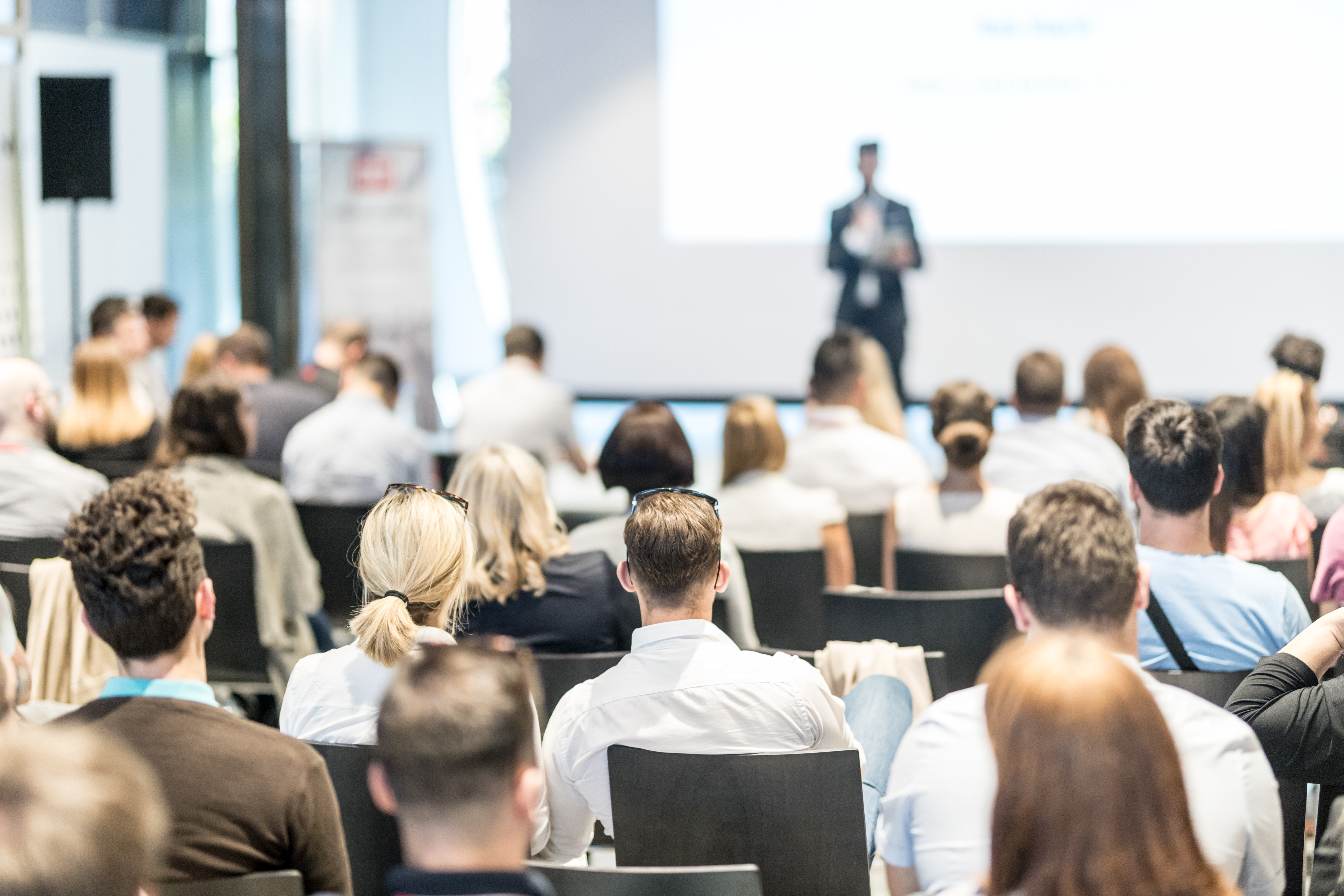 Male Business Speaker Giving A Talk At Business Conference Event