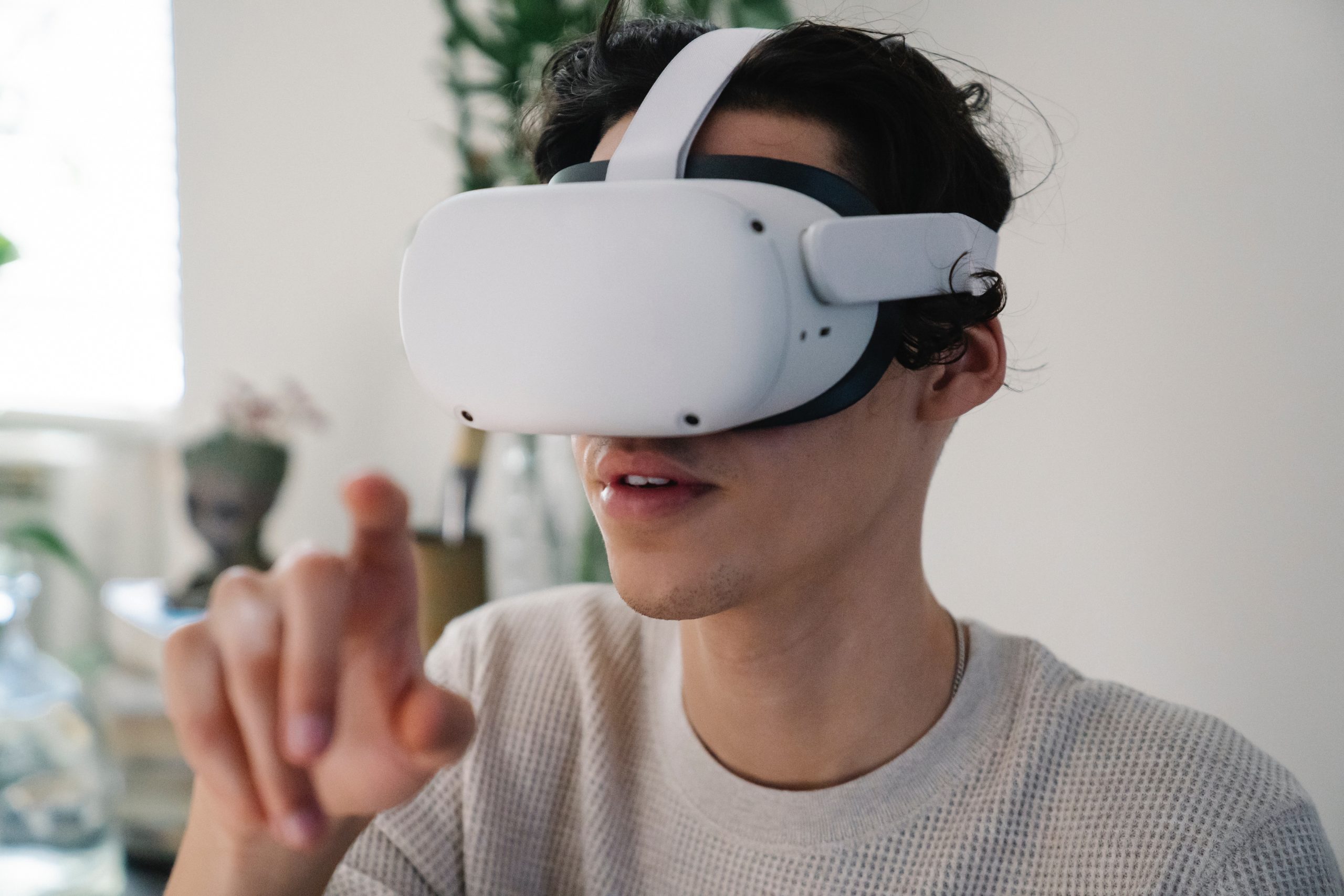 Young male interacting with Virtual Reality