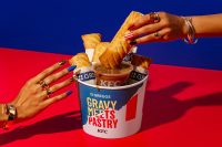 Greggs x KFC sausage roll and gravy dipping bucket advertisement 